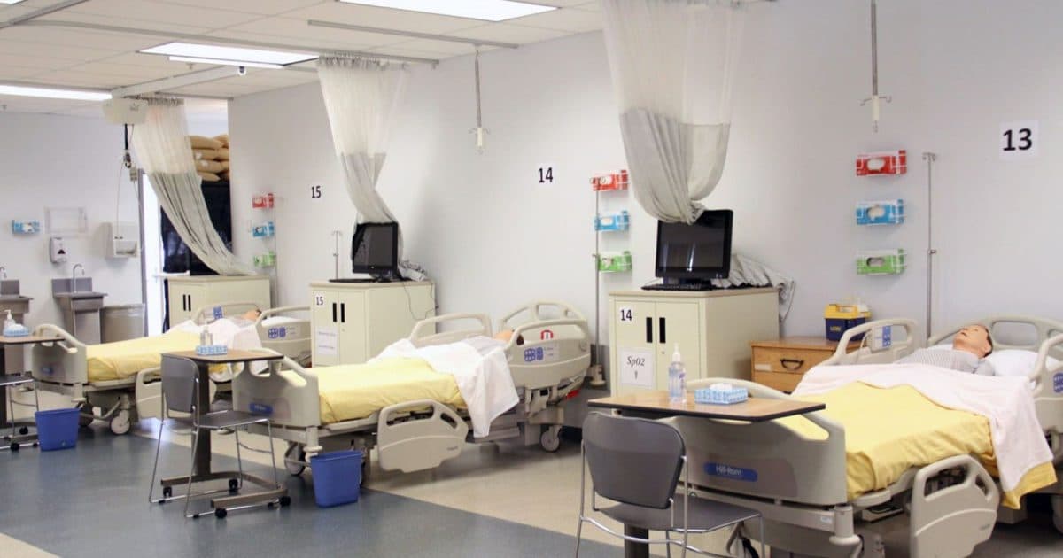 Illustrative nursing simulation room with patient beds and training equipment